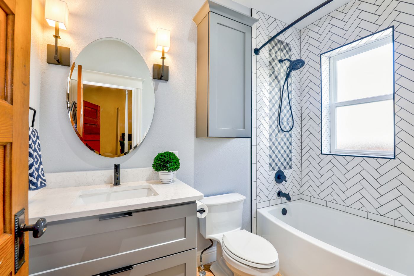 Finished bathroom with herringbone tile, Pexels.
